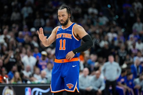 New York Knicks guard Jalen Brunson motions to teammates during the second half of Game 5 of the NBA Finals basketball series against the San Antonio Spurs, Saturday, June 13, 2026, in San Antonio. (AP Photo/Ross D. Franklin)